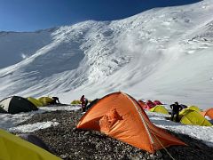 01A Ak-Sai Travel Lenin Peak Camp 2 5400m is on a small rocky ledge above the glacier with Lenin Peak towering overhead